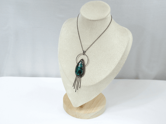Handcrafted 925 sterling silver pendant featuring a vibrant drop-shaped Chrysocolla stone, accented with delicate silver fringe for playful movement and bohemian charm.