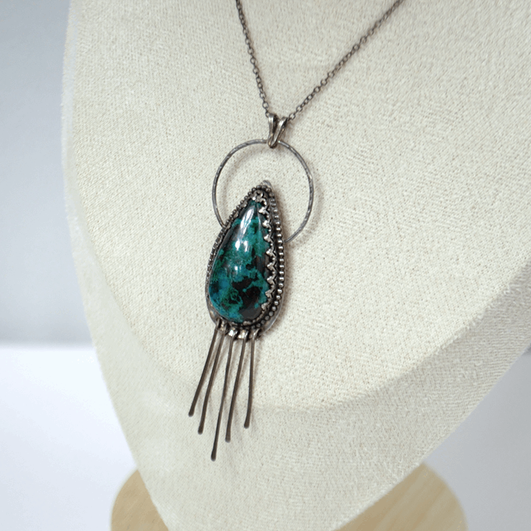Handcrafted 925 sterling silver pendant featuring a vibrant drop-shaped Chrysocolla stone, accented with delicate silver fringe for playful movement and bohemian charm.