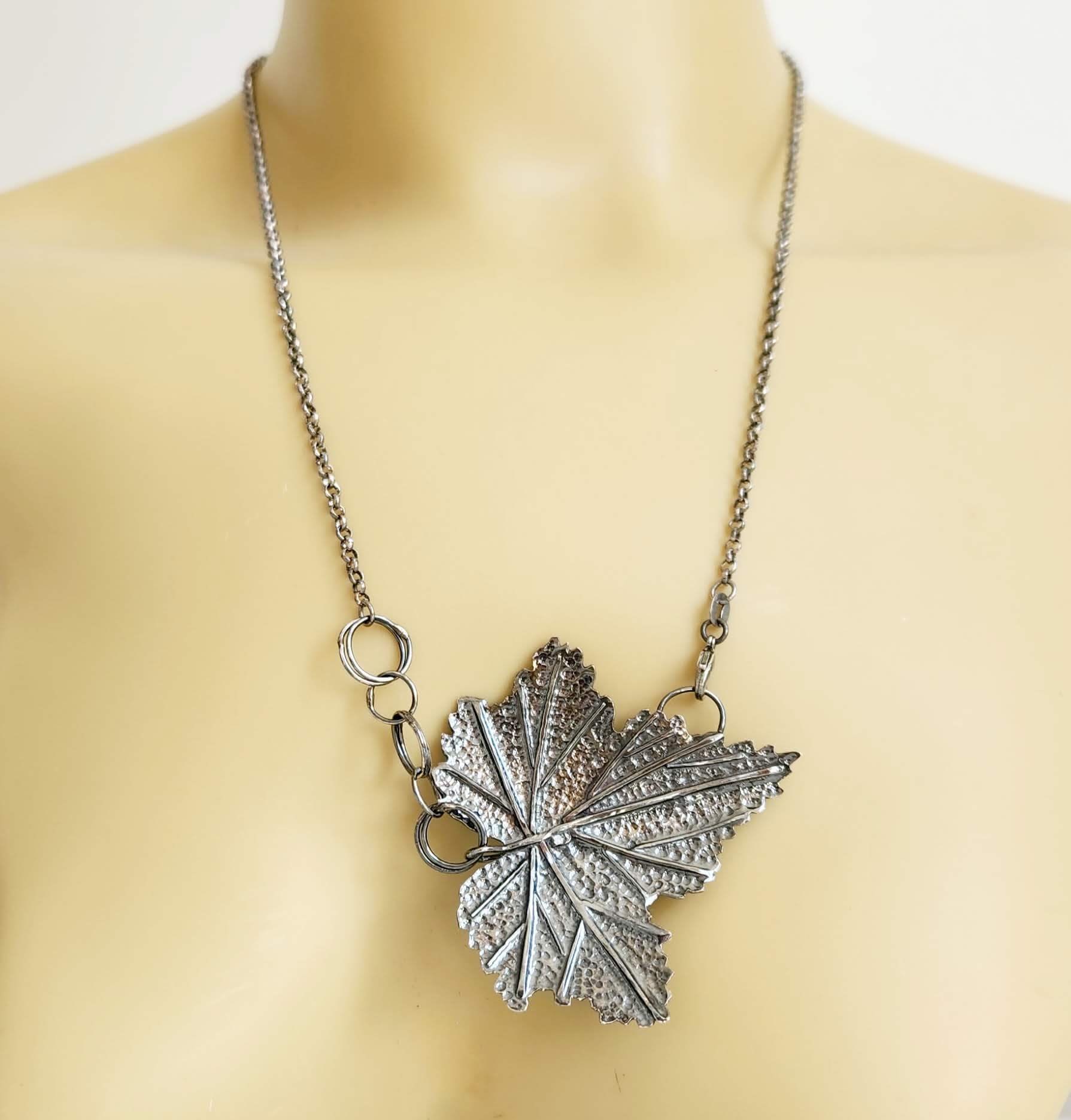 Handcrafted sterling silver necklace featuring an intricately detailed Currant leaf design with realistic veins and texture, exuding elegance and nature-inspired charm.
