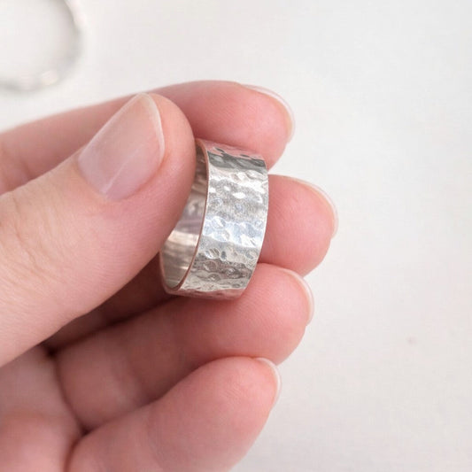Couple making silver rings together in a cozy jewelry workshop in Ottawa